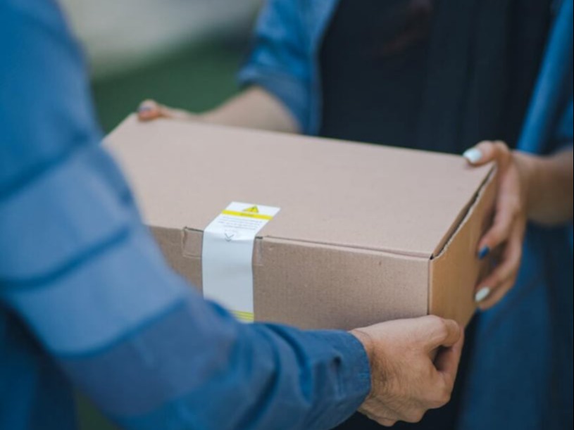person giving black box
